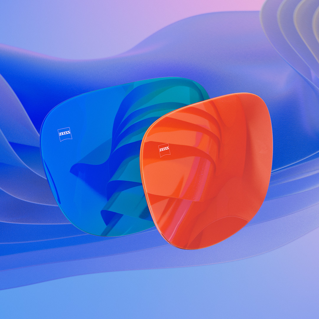Két napszemüveglencse 3D CGI illusztrációja kék és narancssárga tükrös réteggel.